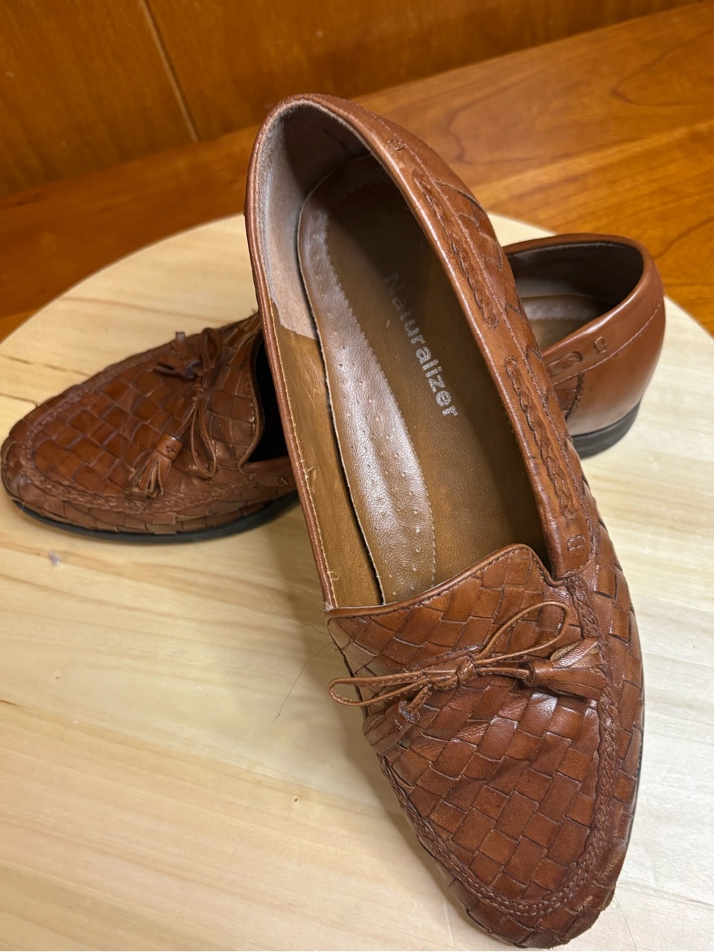 Naturalizer brown woven leather tassel loafers featuring an intricate basketweav